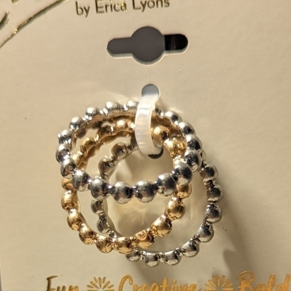 Erica brand. Set of three rings in silver and gold hues.NWT.